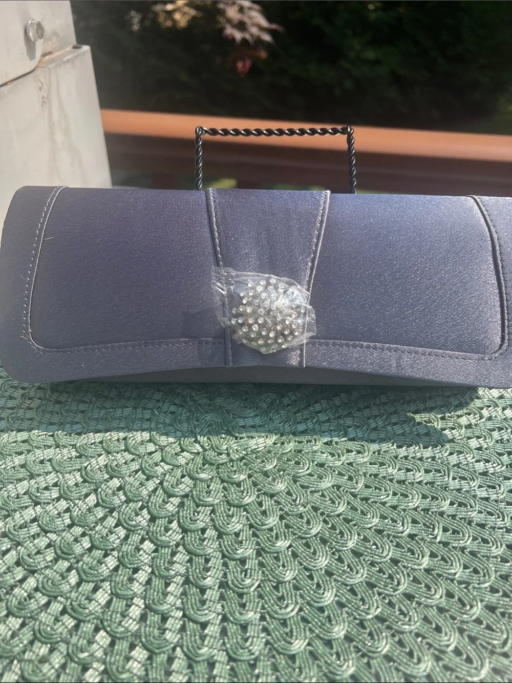NWOT Gray Evening Clutch with clear crystal embellishment.